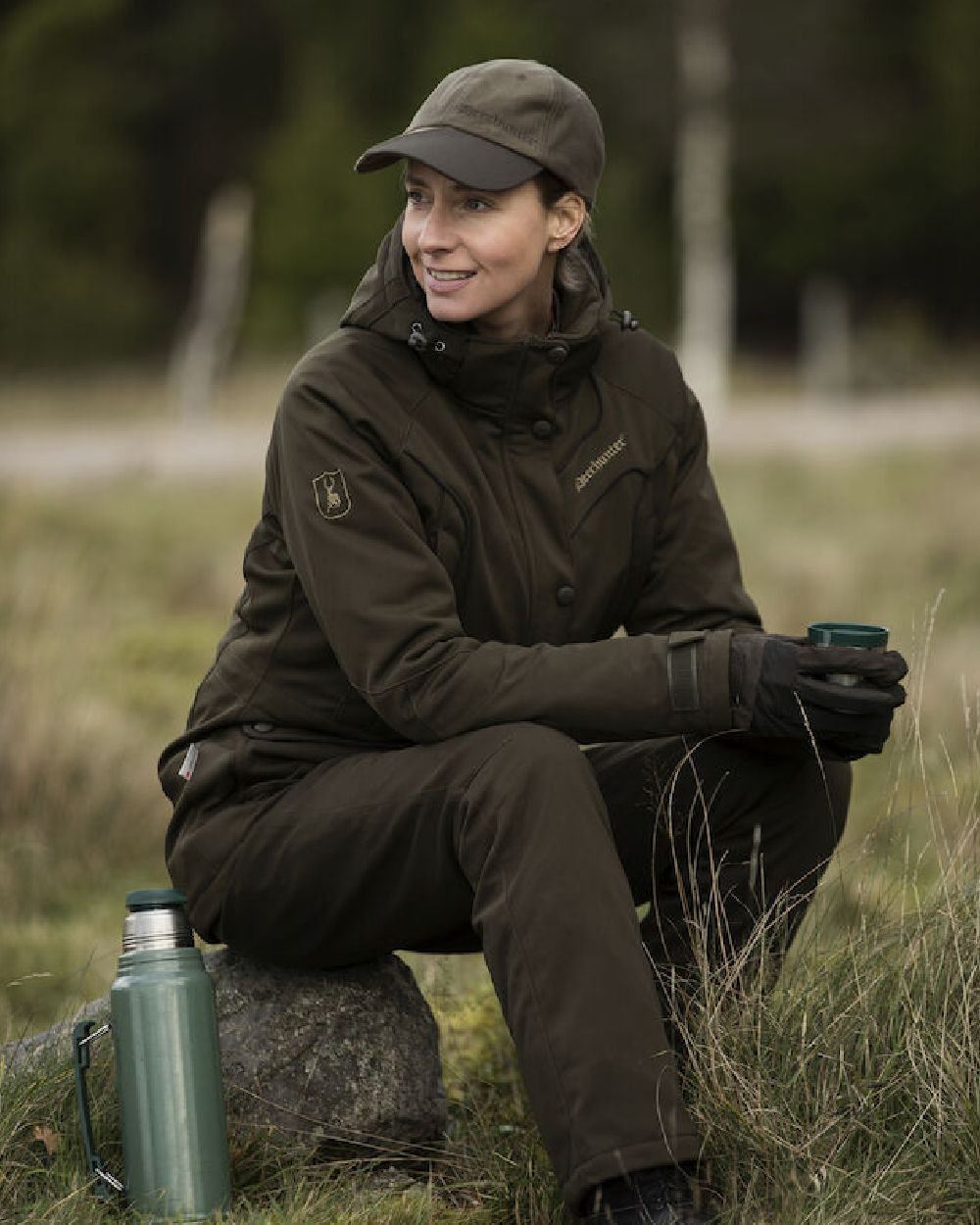 Art Green coloured Deerhunter Lady Mary Trousers on forest background #colour_art-green