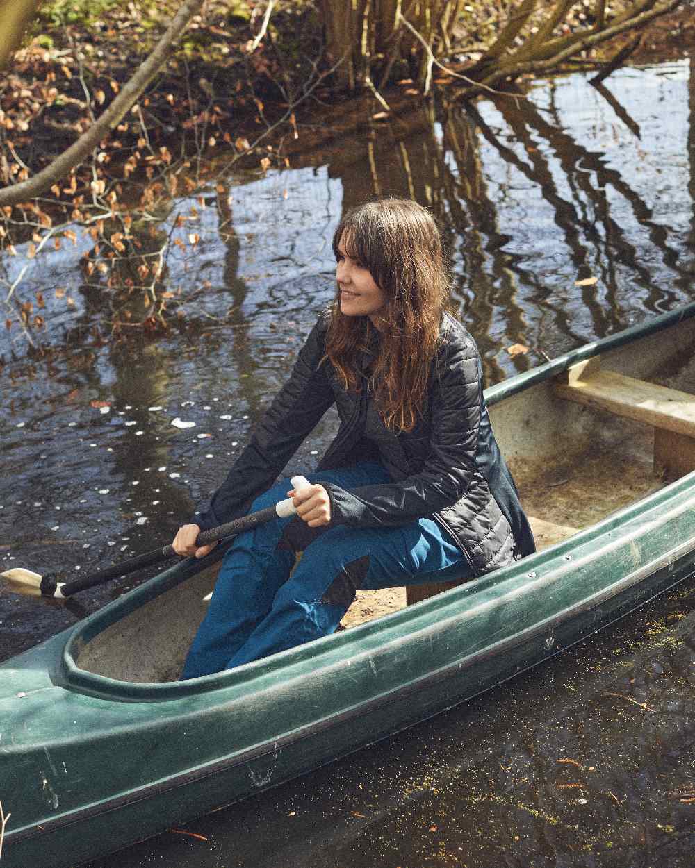 Black coloured Deerhunter Lady Pine Padded Inner Jacket on lake background #colour_black