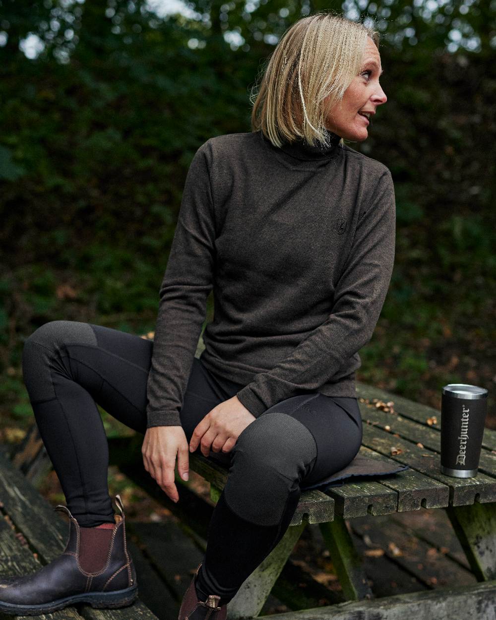 Black coloured Deerhunter Lady Reinforced Tights on wooden bench background #colour_black