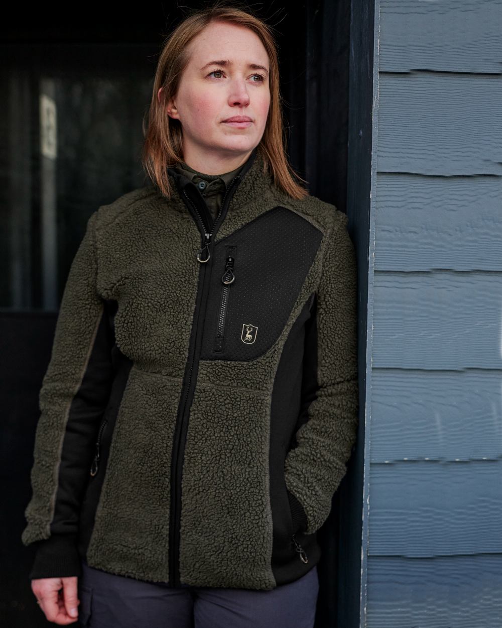 Adventure Green Coloured Deerhunter Lady Roja Fiber Pile Jacket On A Wall Background #colour_adventure-green