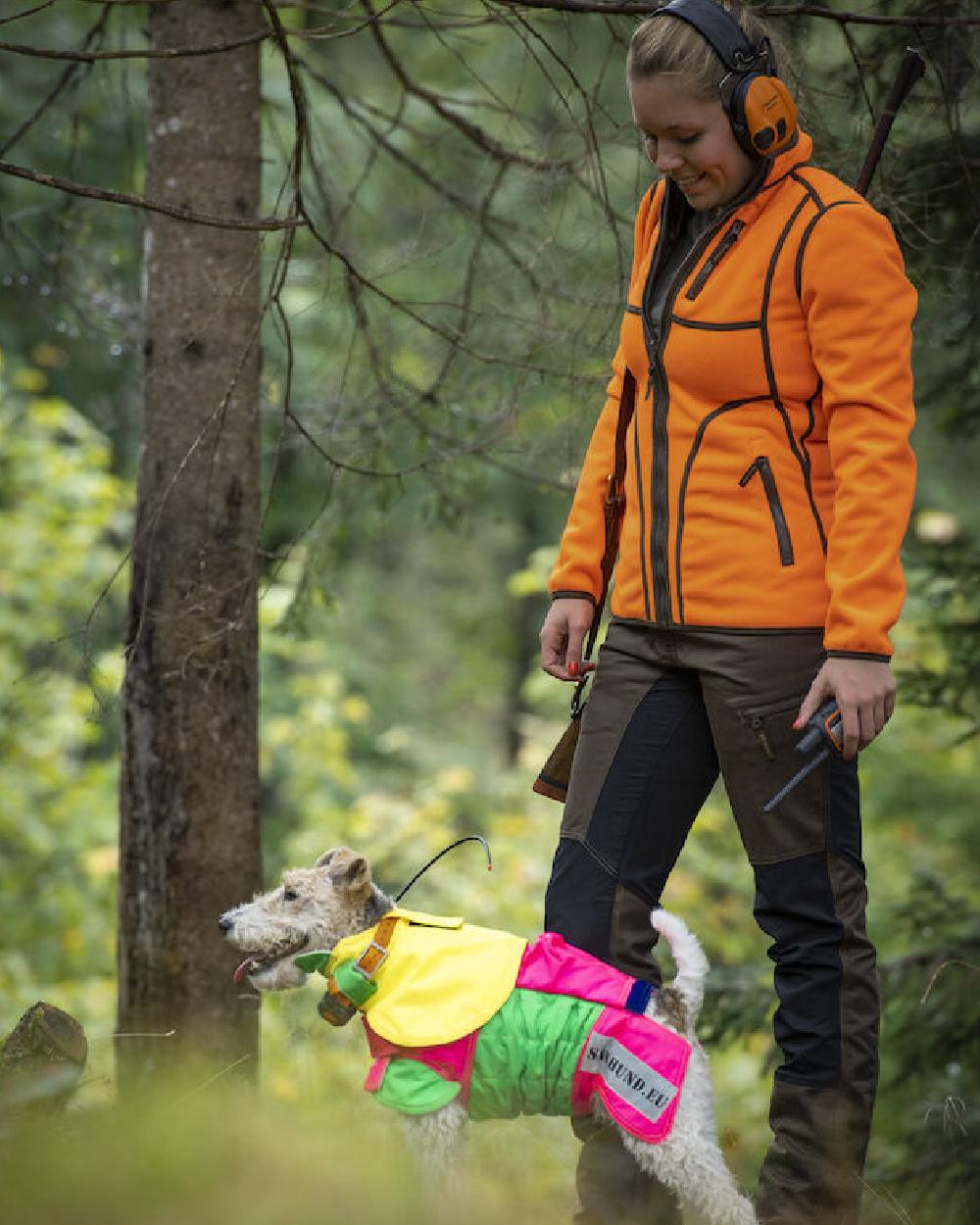 Fallen Leaf coloured Deerhunter Lady Roja Trousers on forest background #colour_fallen-leaf