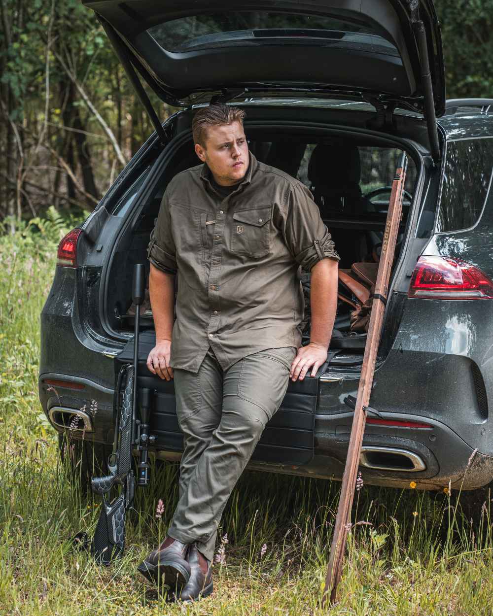 Forest coloured Deerhunter Matobo Trousers on car background #colour_forest-green