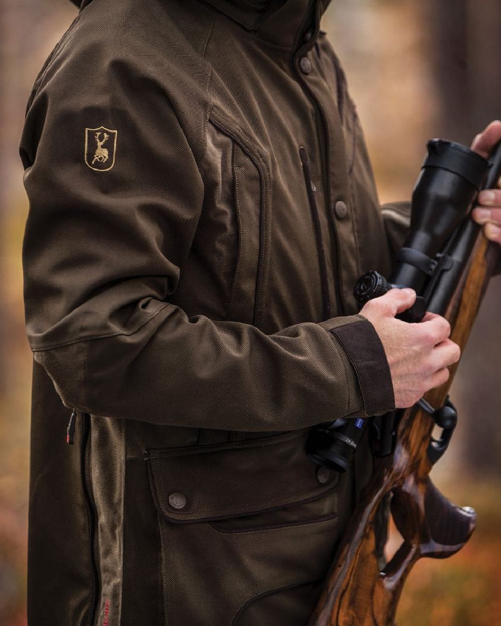 Art Green coloured Deerhunter Muflon Light Jacket on blurry background #colour_art-green