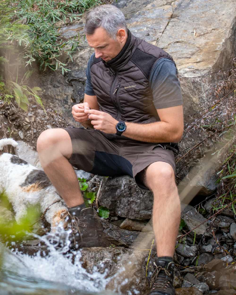 Bark Green coloured Deerhunter Northward Shorts on rock background #colour_bark-green