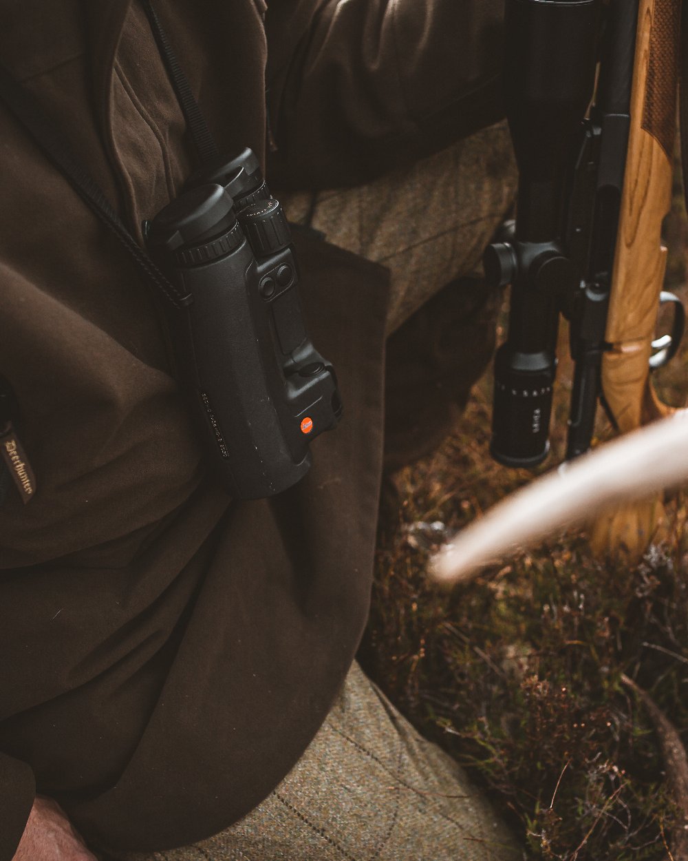 Peat Coloured Deerhunter PRO Gamekeeper Jacket on land background #colour_peat