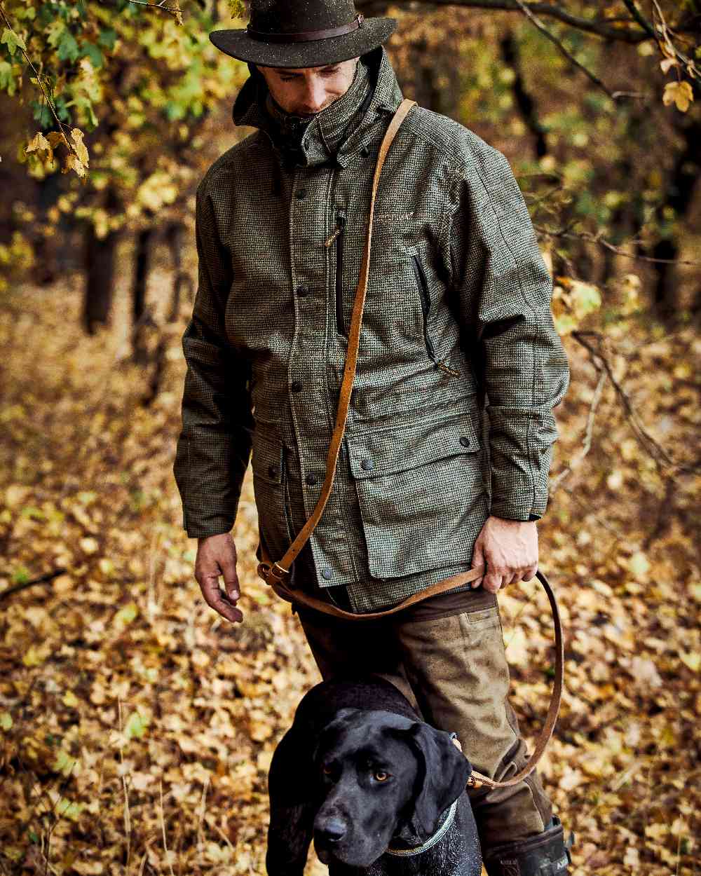 Turf Coloured Deerhunter PRO Gamekeeper Jacket on forest background #colour_turf