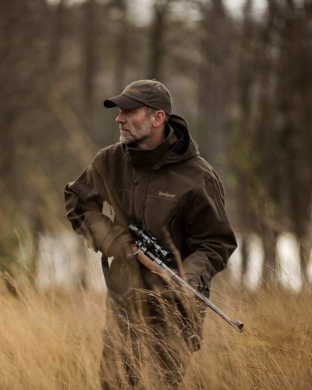 Peat Coloured Deerhunter PRO Gamekeeper Smock on forest background #colour_peat