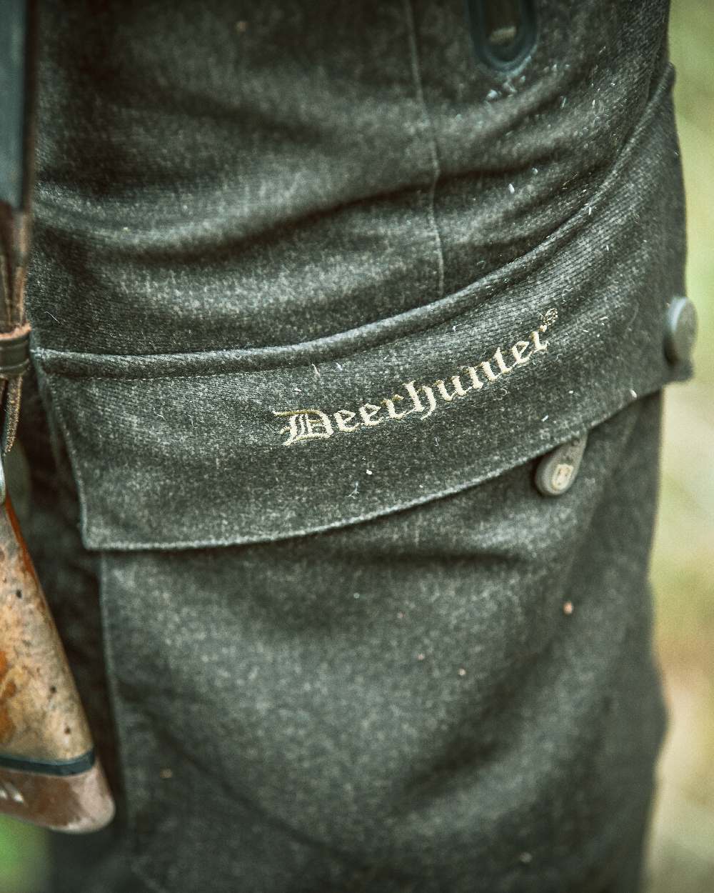 Elmwood coloured Deerhunter Ram Trousers on blurry background #colour_elmwood