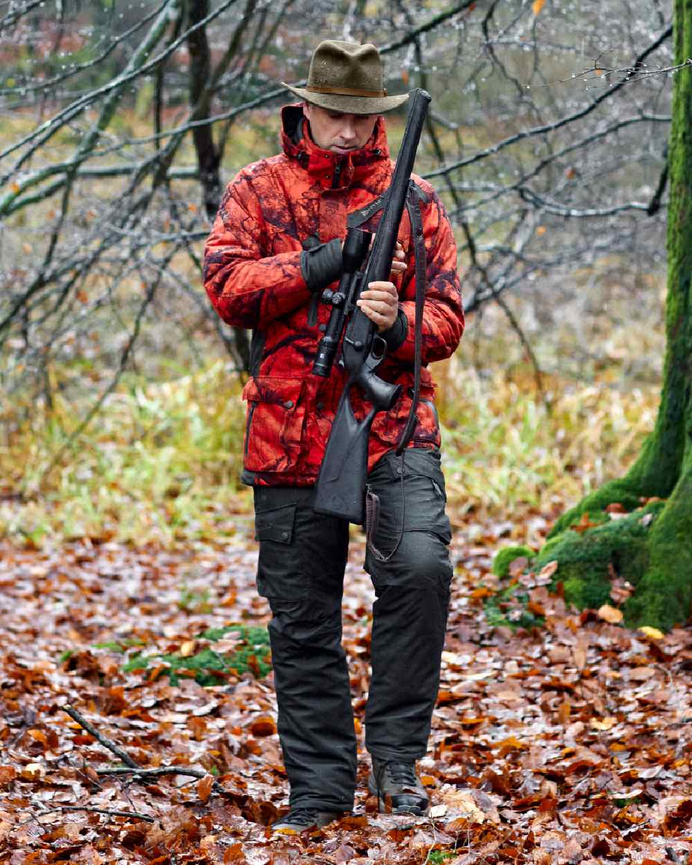 Elmwood coloured Deerhunter Ram Winter Trousers on forest background #colour_elmwood