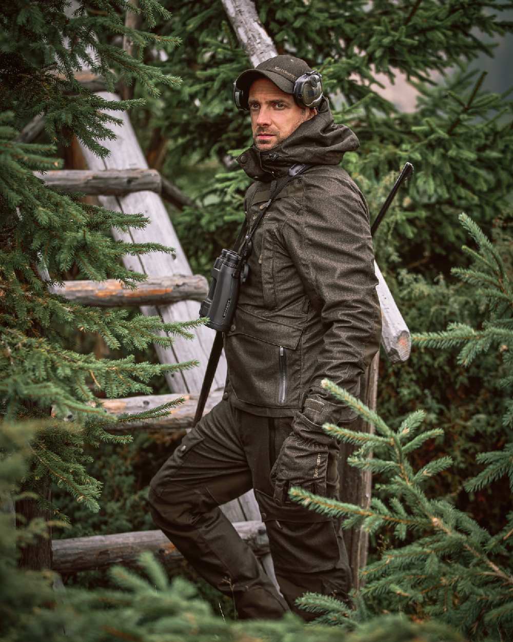 Elmwood coloured Deerhunter Ram Winter Trousers on forest background #colour_elmwood