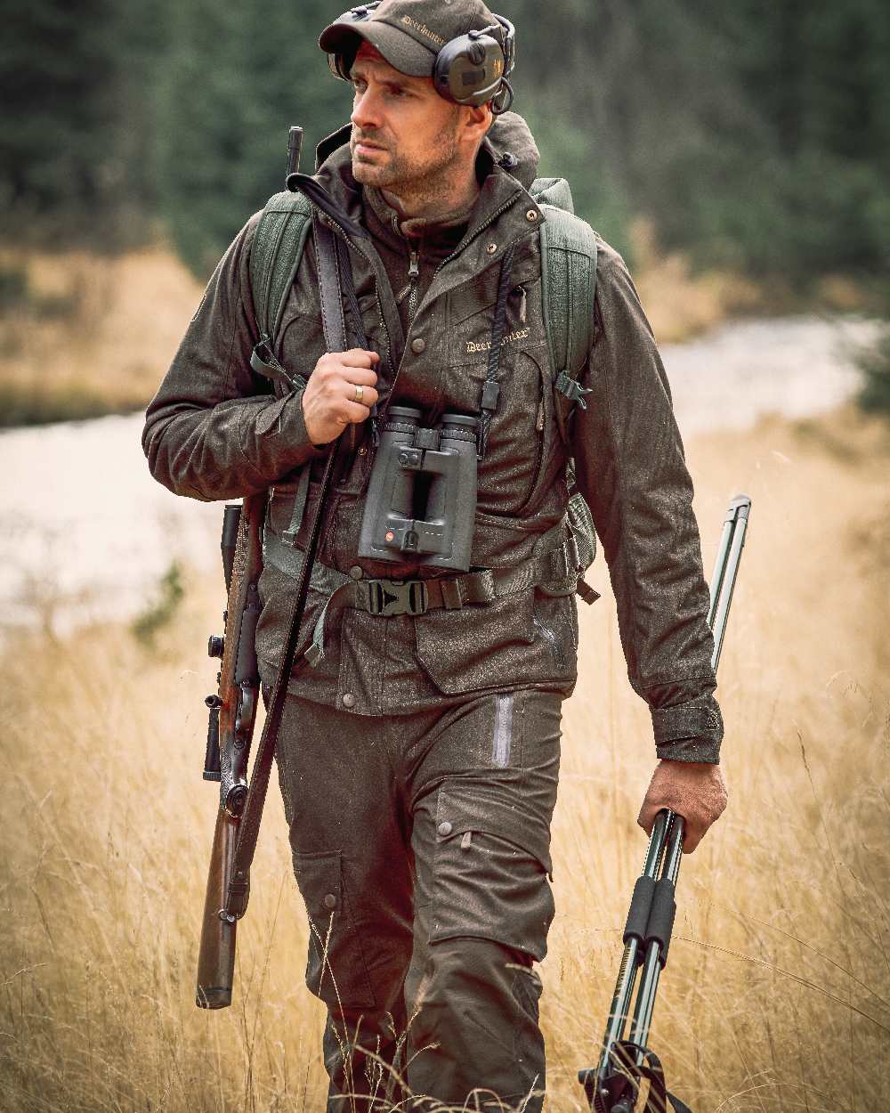 Elmwood coloured Deerhunter Ram Winter Trousers on grassy background #colour_elmwood
