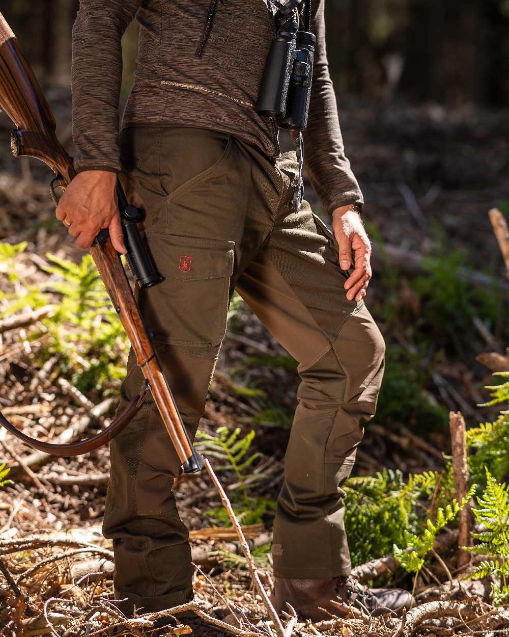 Adventure Green Coloured Deerhunter Rogaland Stretch Trousers on forest background #colour_adventure-green