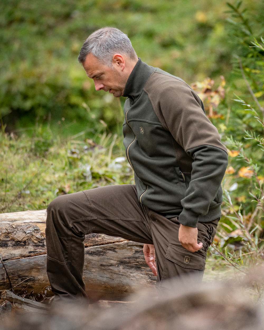 Fallen Leaf coloured Deerhunter Rogaland Trousers on forest background #colour_fallen-leaf