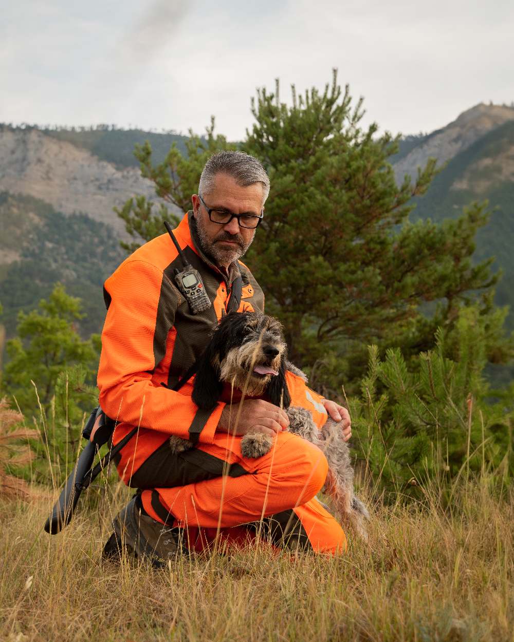 Orange coloured Deerhunter Strike Extreme Waterproof Jacket With Membrane on mountain background #colour_orange