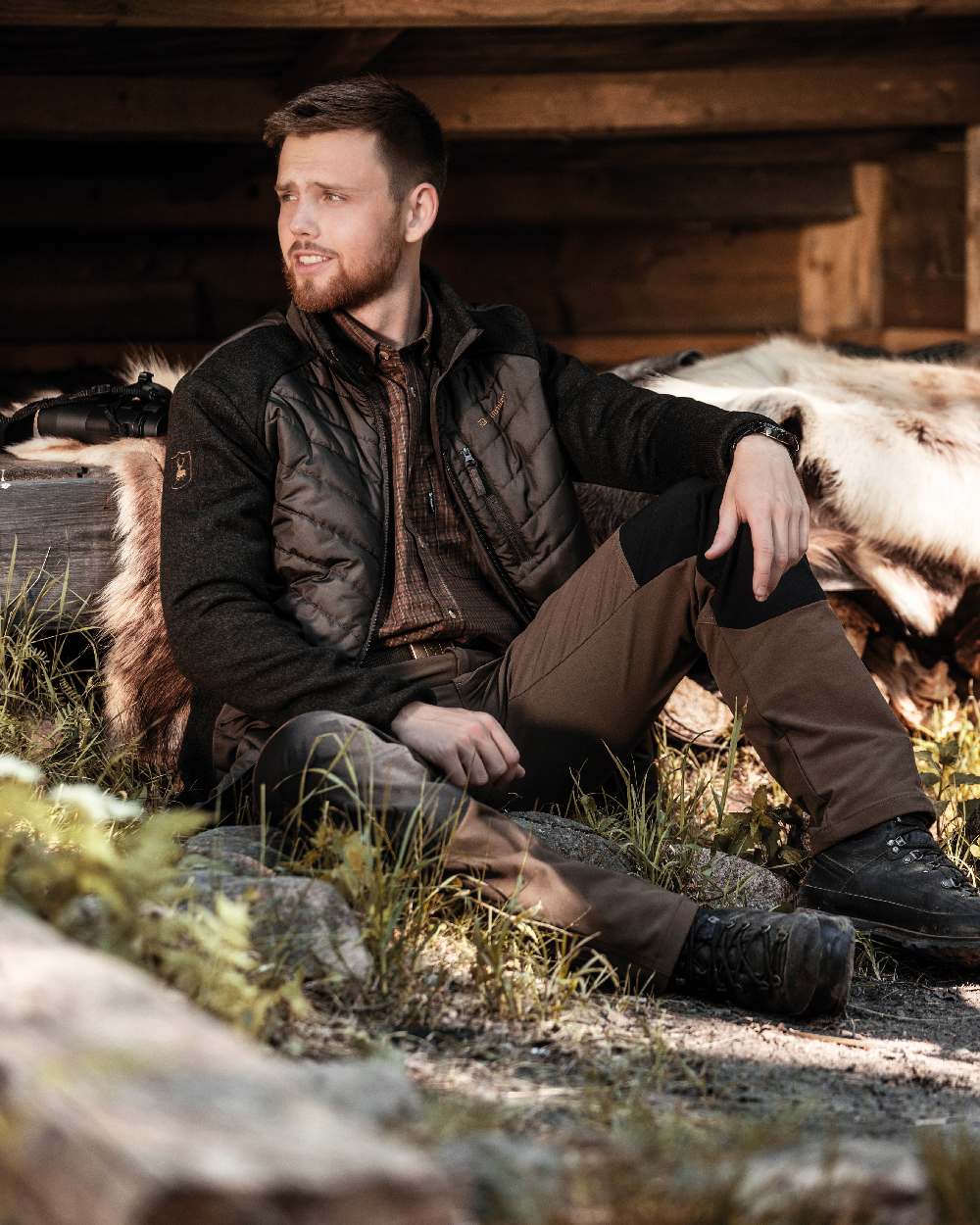 Black Fallen Leaf coloured Deerhunter Strike Full Stretch Trousers on forest background #colour_black-fallen-leaf