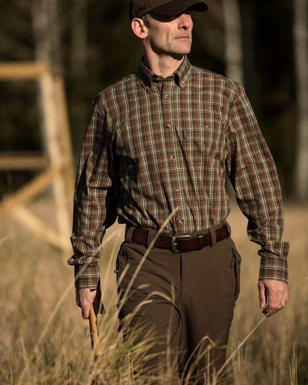 Fallen Leaf coloured Deerhunter Strike Full Stretch Trousers on forest background #colour_fallen-leaf