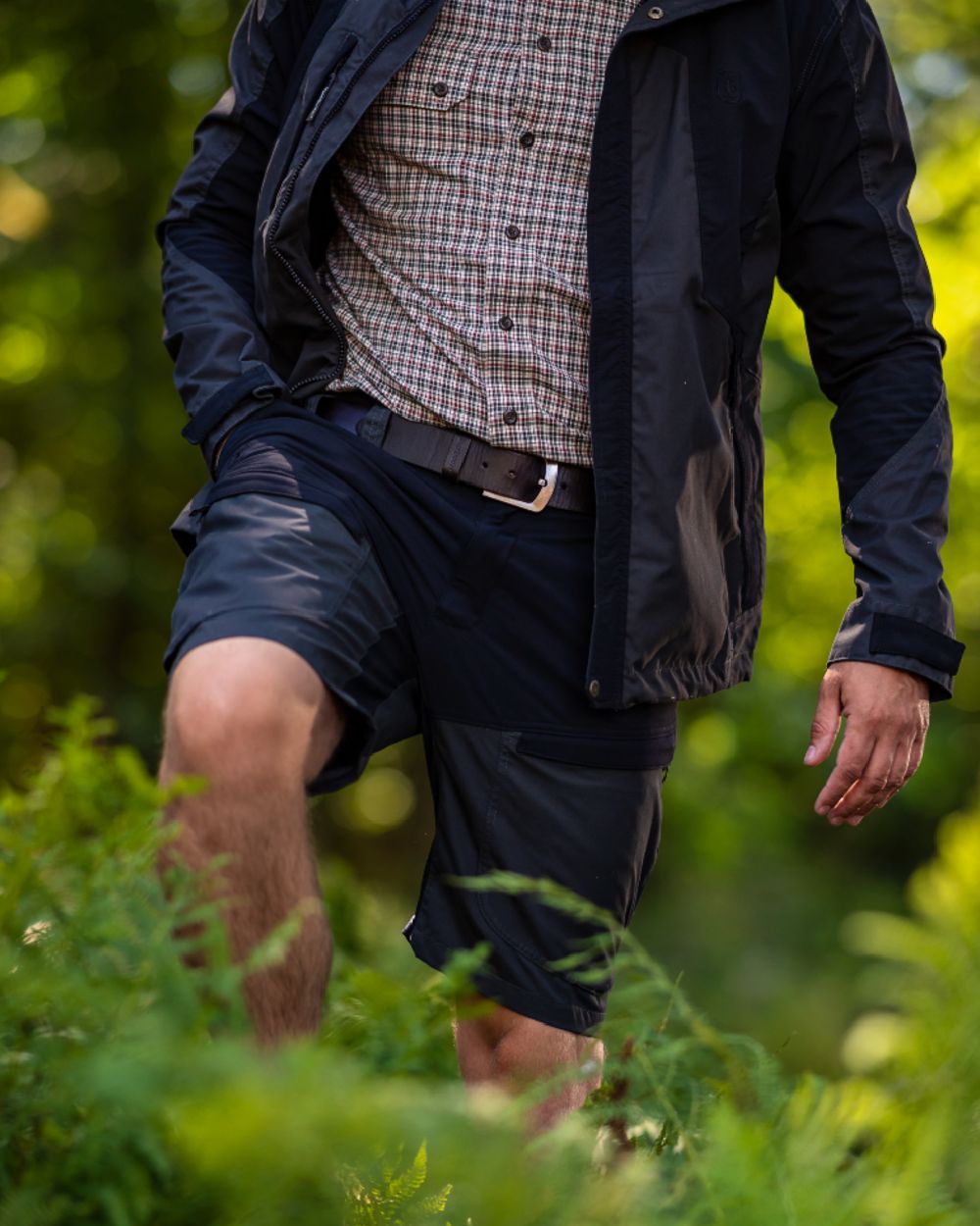 Black Ink coloured Deerhunter Strike Shorts on forest background #colour_black-ink