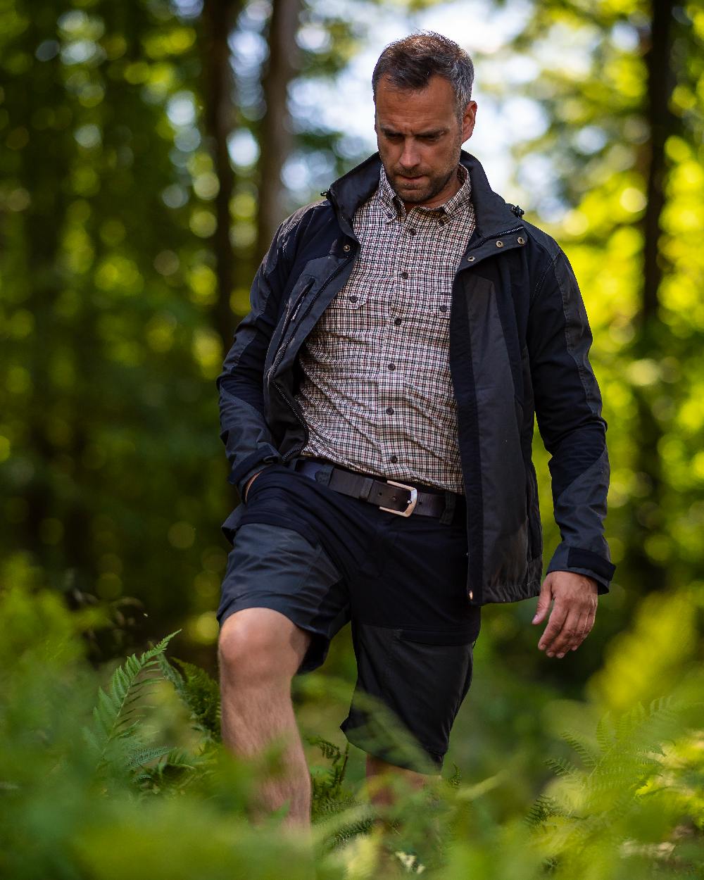 Black Ink coloured Deerhunter Strike Shorts on forest background #colour_black-ink