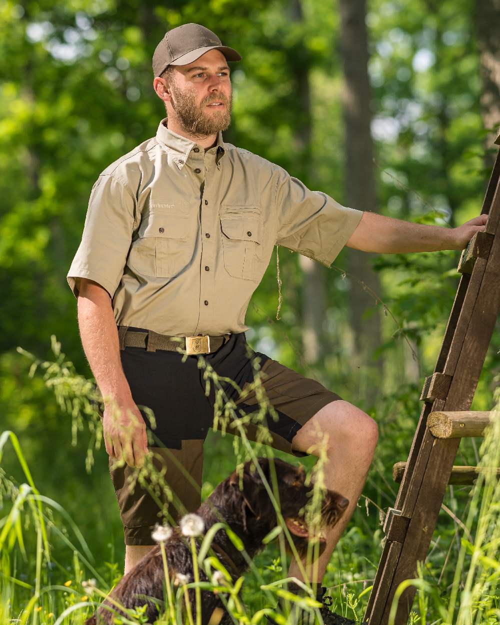 Deep Green coloured Deerhunter Strike Shorts on forest background #colour_deep-green