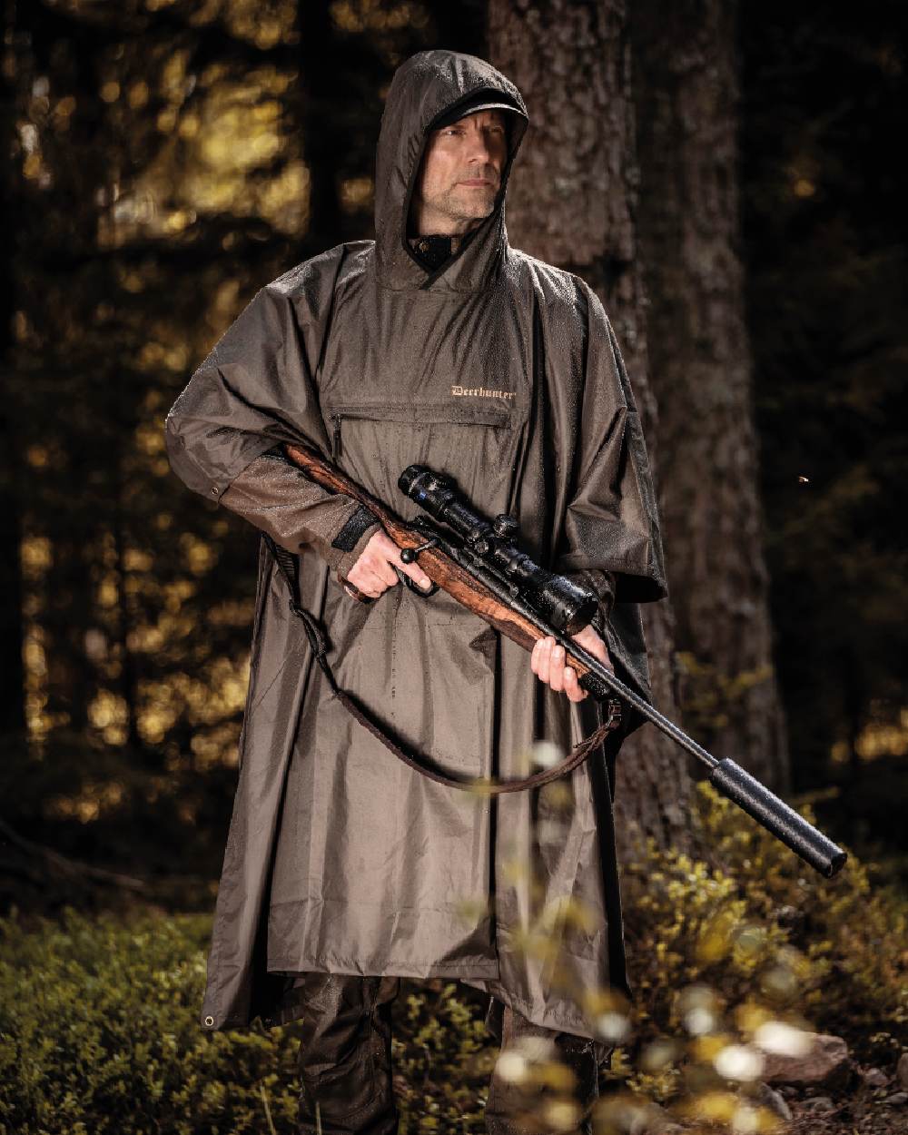 Timber coloured Deerhunter Survivor Rain Poncho on forest background #colour_timber