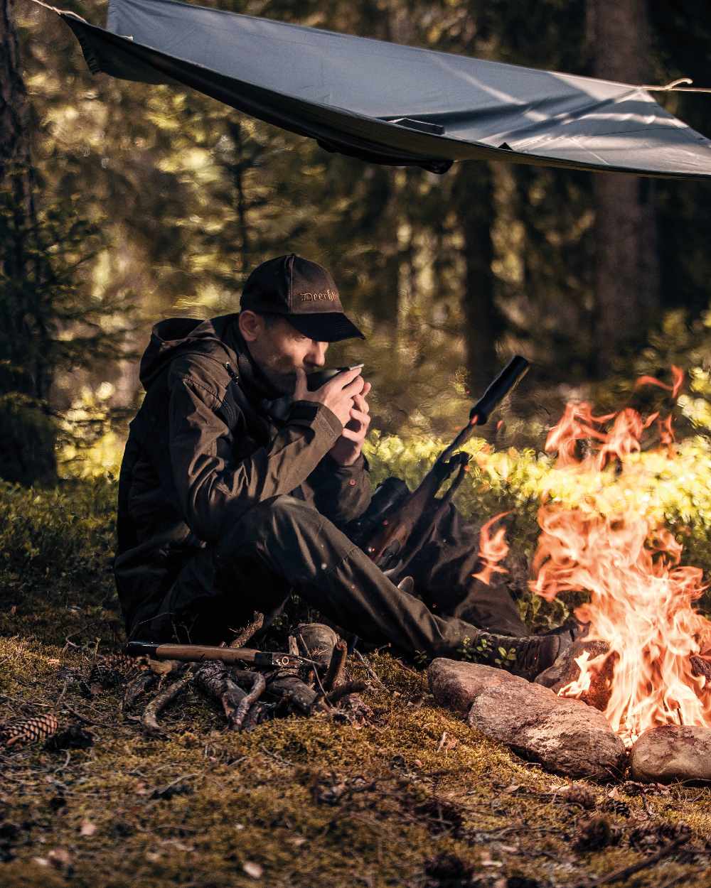Timber coloured Deerhunter Survivor Rain Poncho on forest background #colour_timber