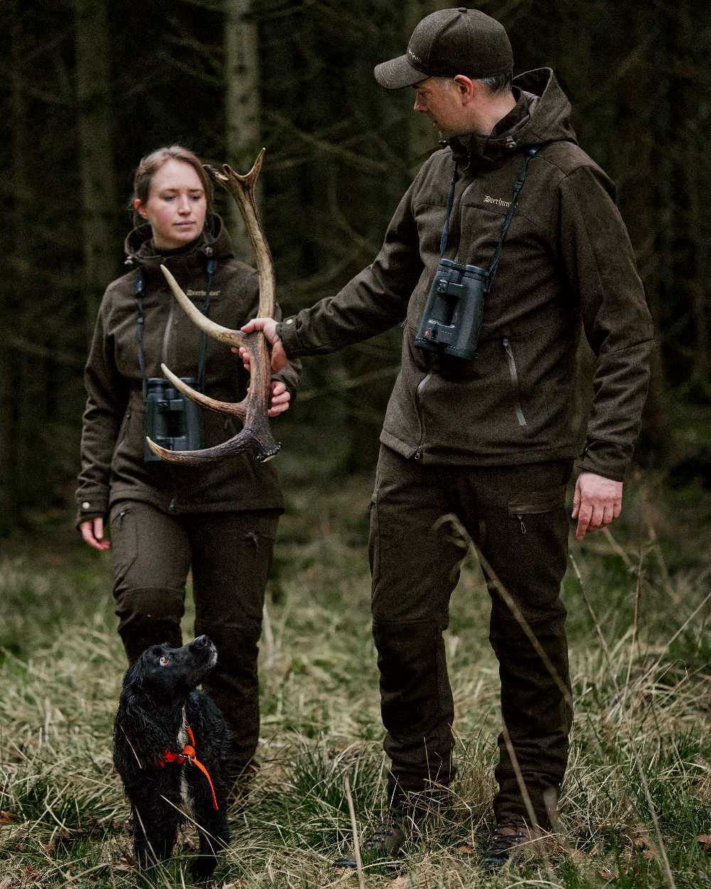 Loden Wood coloured Deerhunter Tatra Active Jacket on forest background #colour_loden-wood