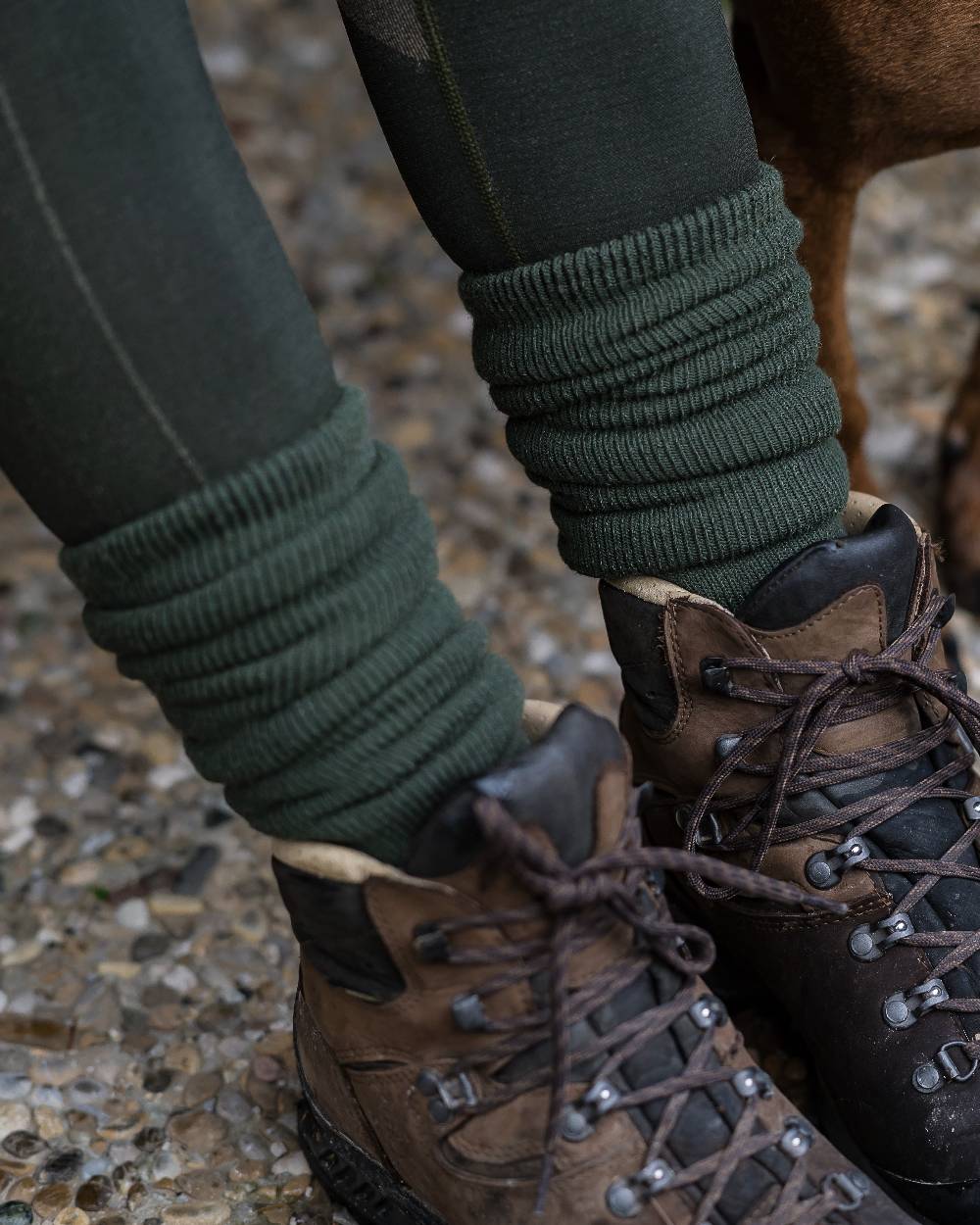 Grape Leaf coloured Deerhunter Wool Socks Deluxe Long on street background #colour_grape-leaf