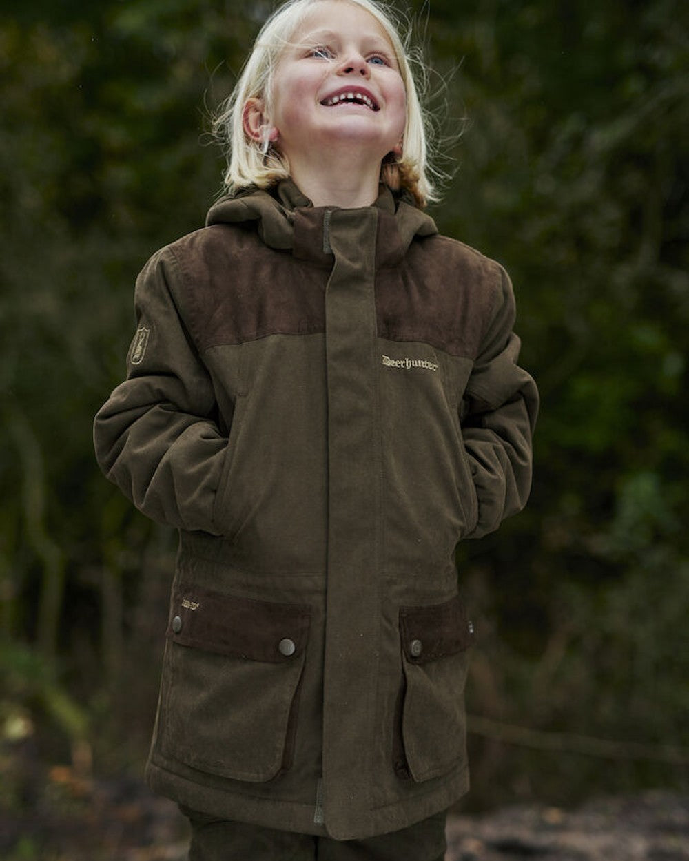 Tarmac Green coloured Deerhunter Youth Eagle Winter Jacket on Forest background #colour_tarmac-green