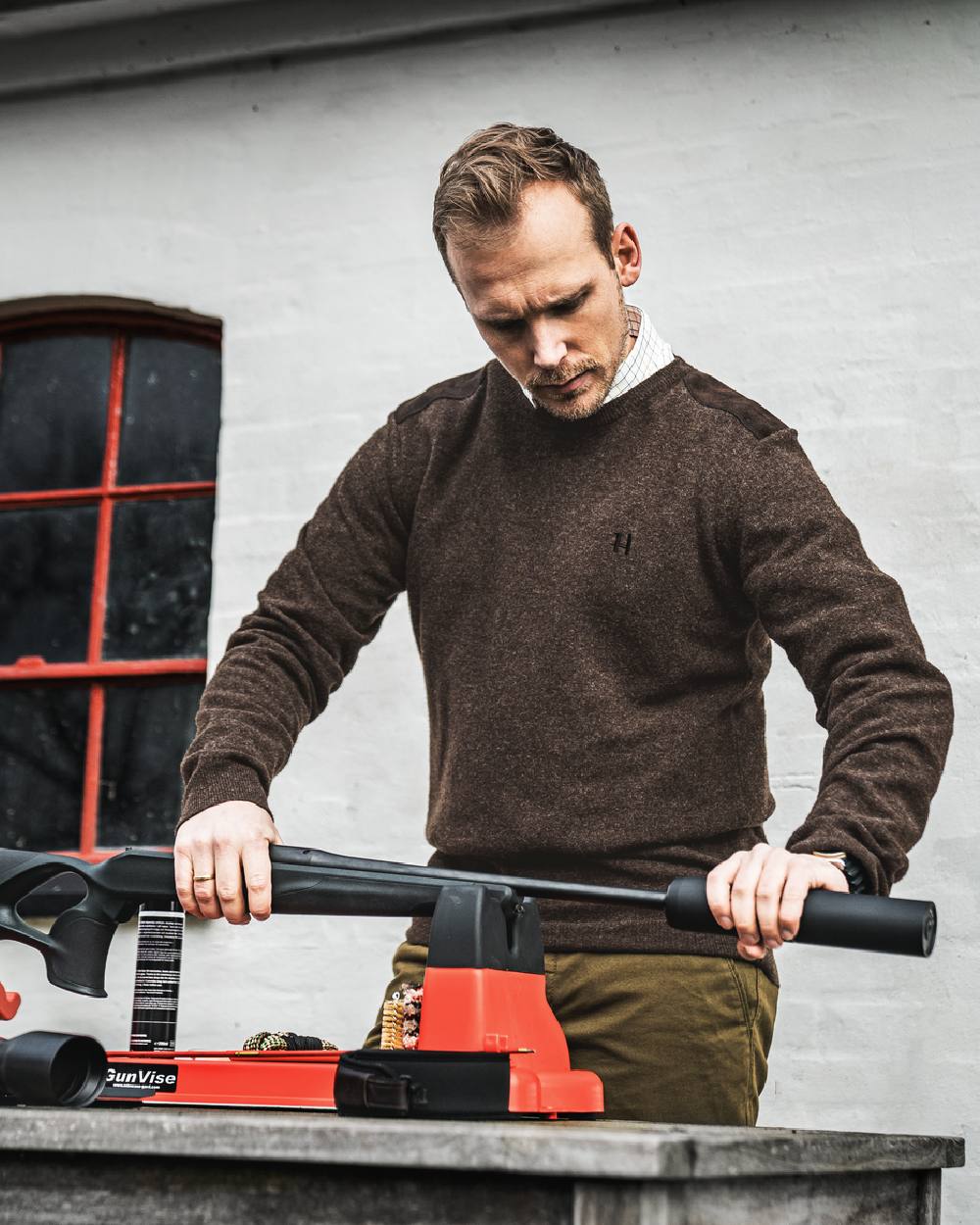 Slate Brown Coloured Harkila Arran Pullover on outdoor background #colour_slate-brown