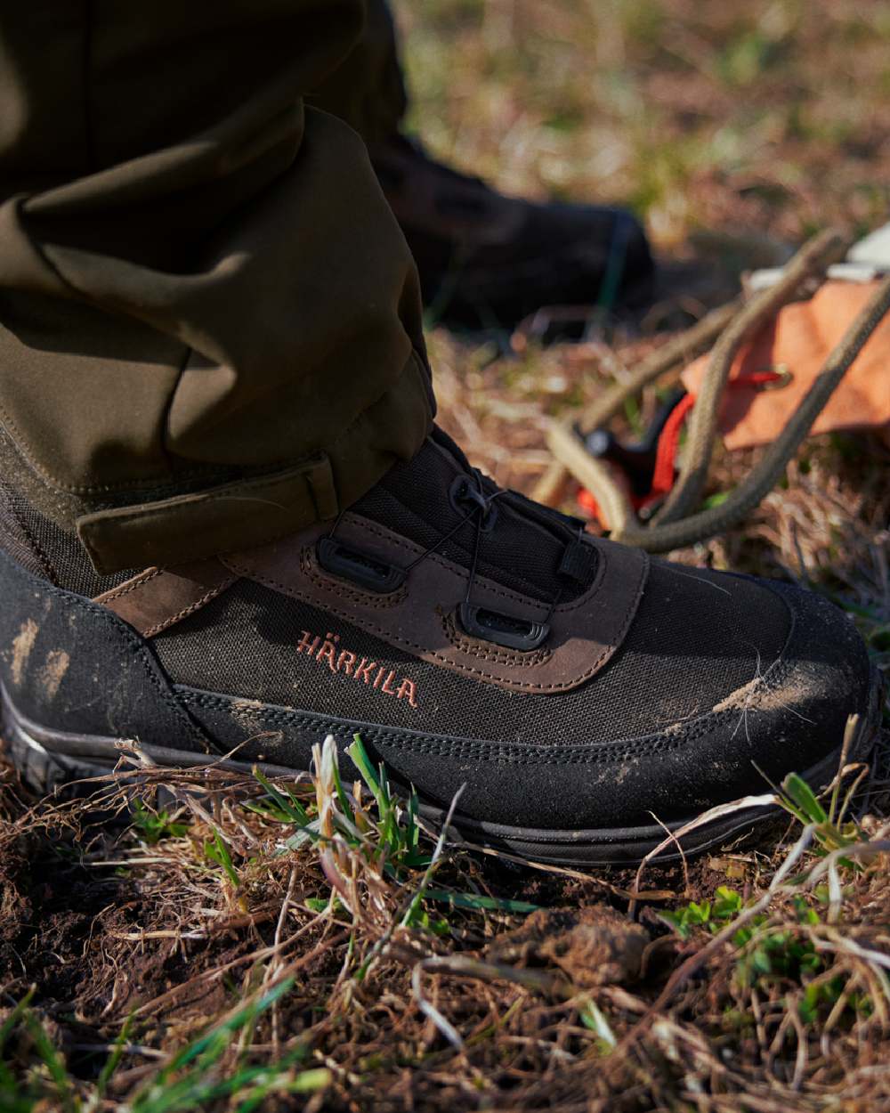 Dark Brown Coloured Harkila Atammik GTX Waterproof Boots on outdoor background #colour_dark-brown