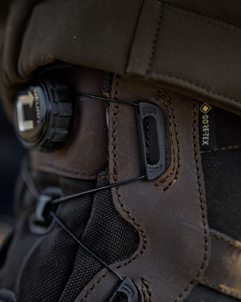 Dark Brown Coloured Harkila Atammik GTX Waterproof Boots on outdoor background #colour_dark-brown