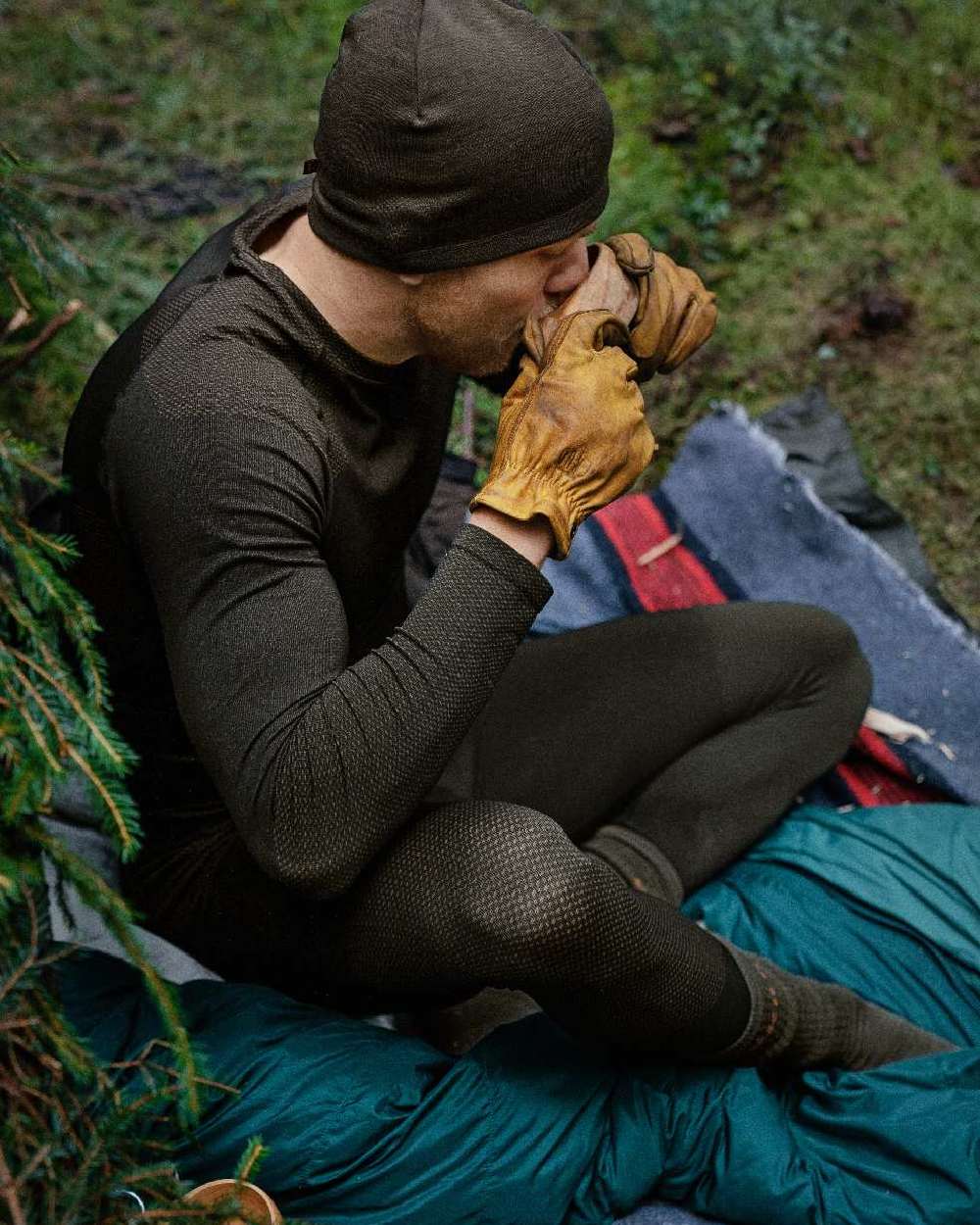 Dark Willow Green Coloured Harkila Base Active Long Sleeve O-Neck on forest background #colour_dark-willow-green