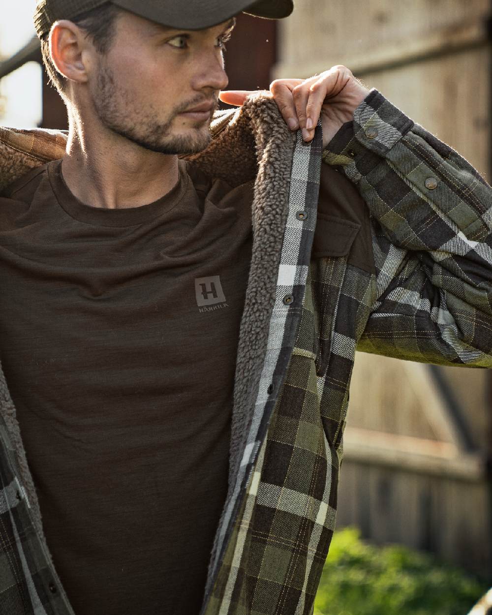 Shadow Brown Coloured Harkila Base All Season Short Sleeve T-Shirt on outdoor background #colour_shadow-brown