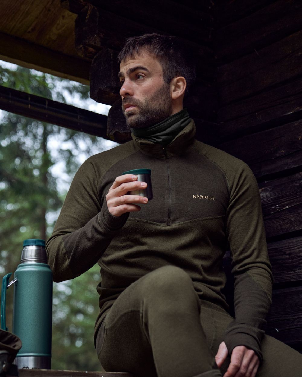 Willow Green Shadow Brown Coloured Harkila Base Warm Zip Neck on countryside background #colour_willow-green-shadow-brown