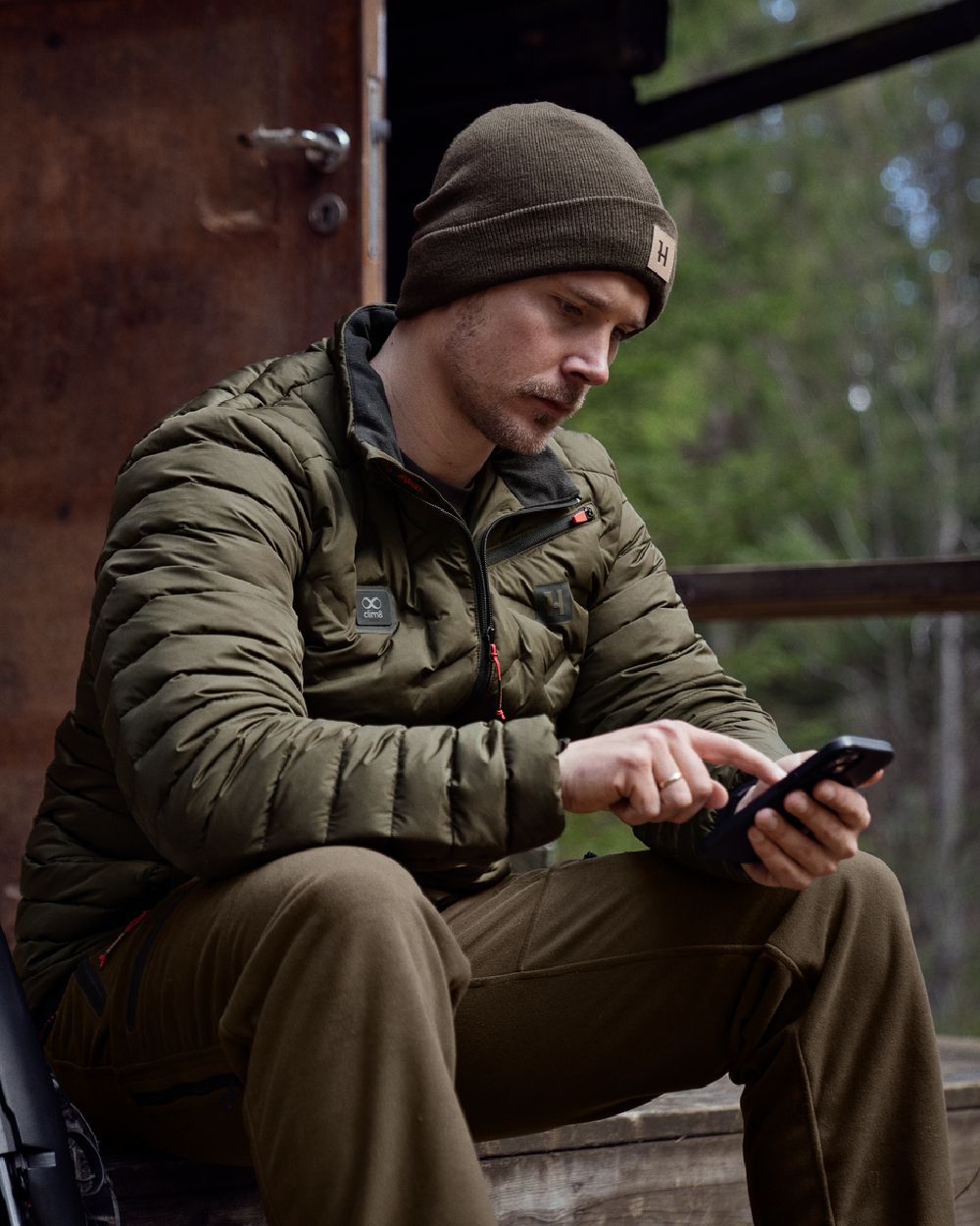 Willow Green Coloured Harkila Clim8 Insulated Jacket on outdoor background #colour_willow-green