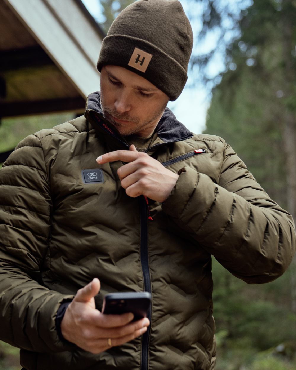 Willow Green Coloured Harkila Clim8 Insulated Jacket on outdoor background #colour_willow-green