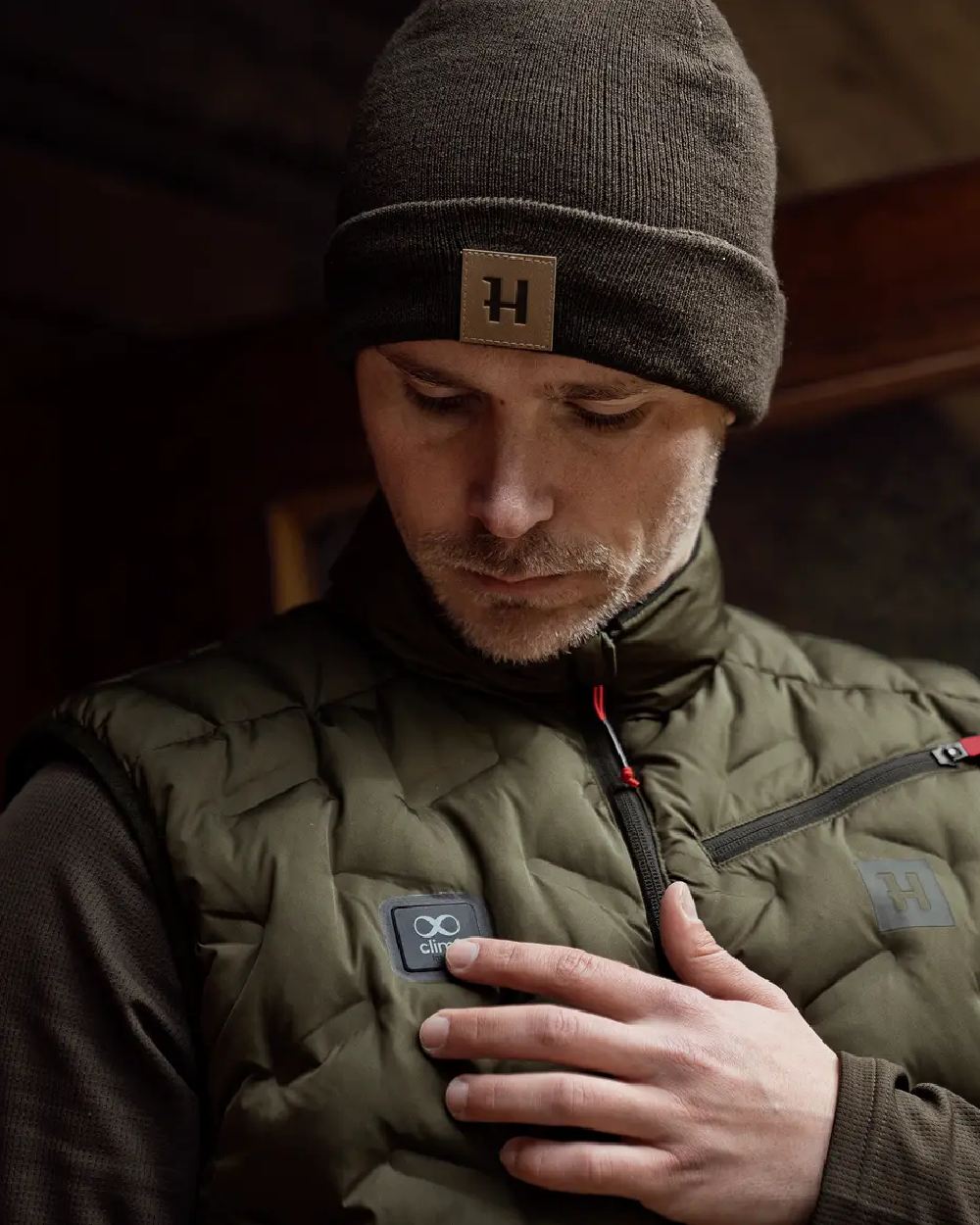 Willow Green Coloured Harkila Clim8 Insulated Waistcoat on outdoor background #colour_willow-green