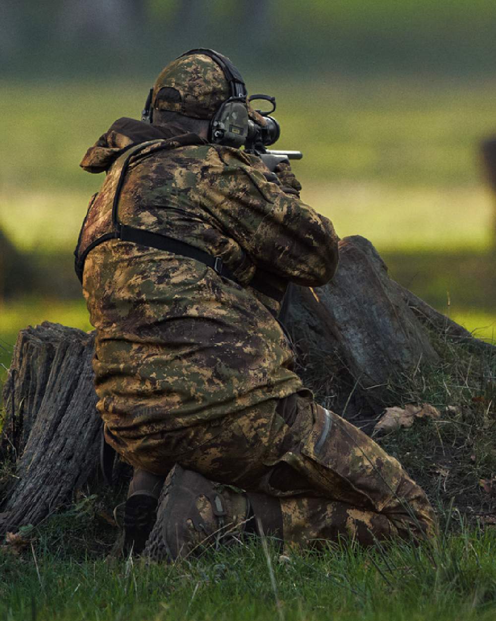 AXIS Forest Coloured Harkila Deer Stalker Camo HWS Jacket on forest background #colour_axis-forest