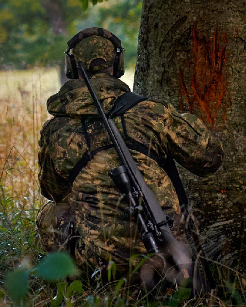 AXIS Forest Coloured Harkila Deer Stalker Camo HWS Jacket on forest background #colour_axis-forest
