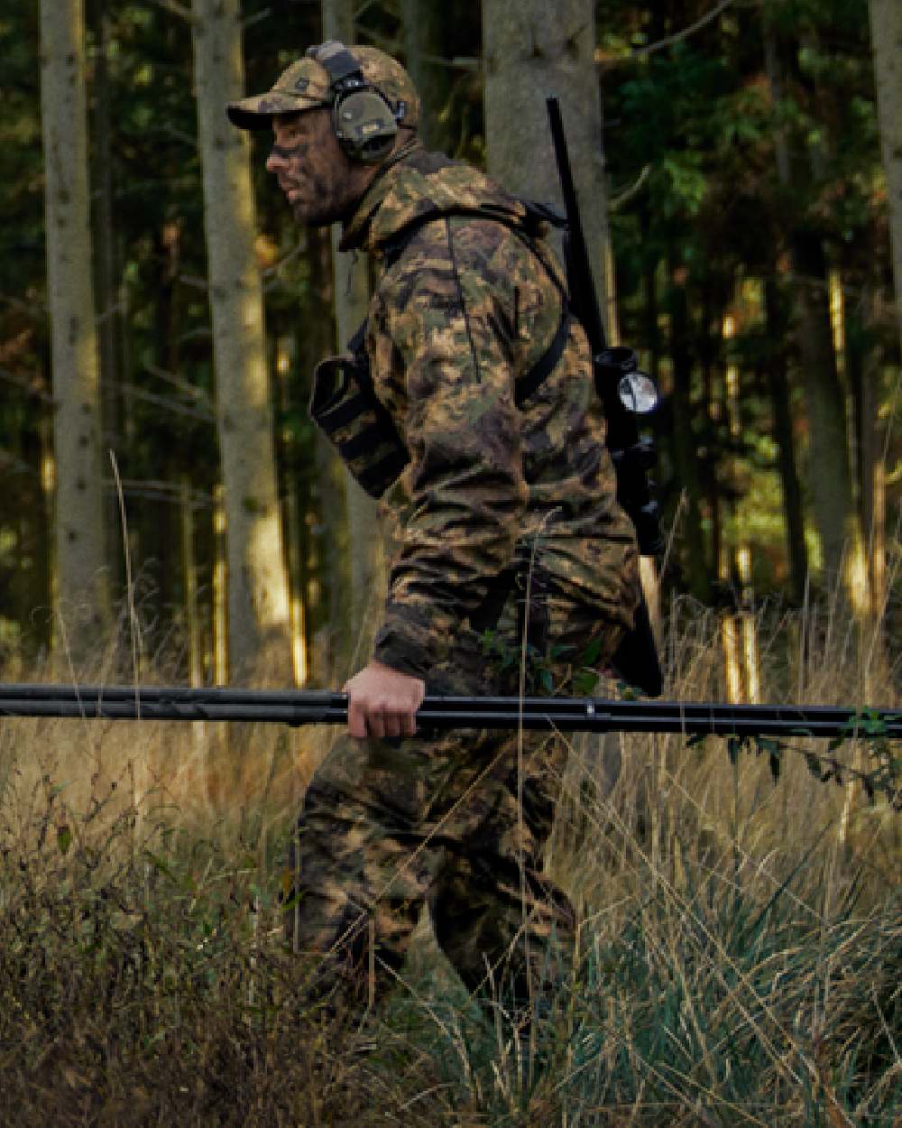 AXIS Forest Coloured Harkila Deer Stalker Camo HWS Jacket on forest background #colour_axis-forest