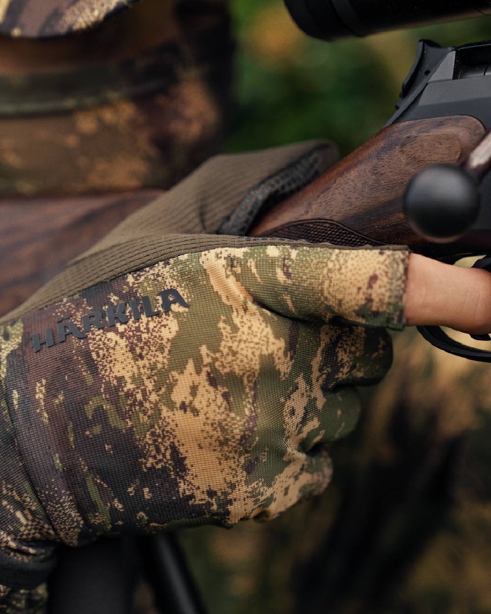 AXIS Forest coloured Harkila Deer Stalker Camo Mesh Gloves on blurry background #colour_axis-forest
