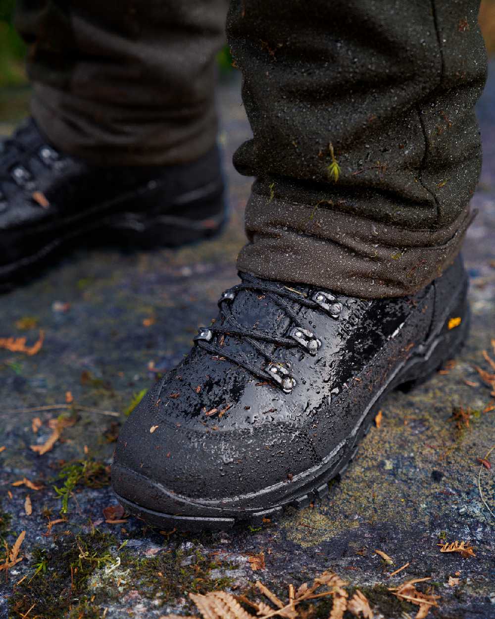 Black Coloured Harkila Driven Hunt 2.0 GTX Boots on outdoor background #colour_black