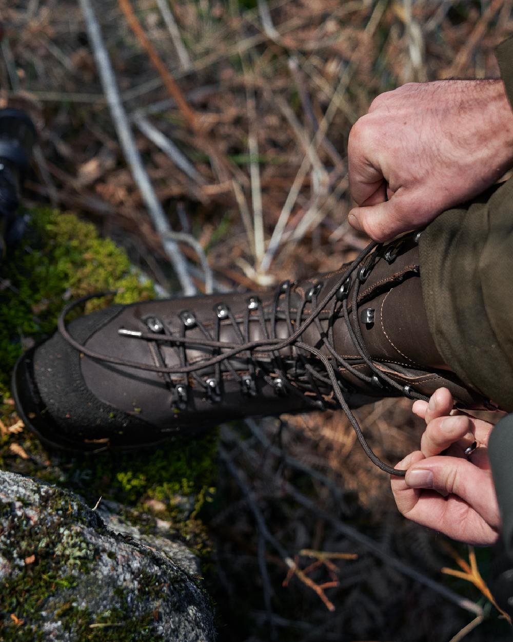 Dark Brown Coloured Harkila Driven Hunt 2.0 GTX Boots on outdoor background #colour_dark-brown