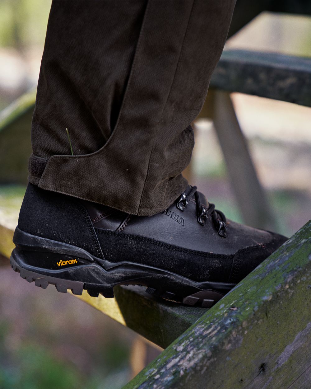 Dark Brown Coloured Harkila Driven Hunt 2.0 GTX Boots on outdoor background #colour_dark-brown