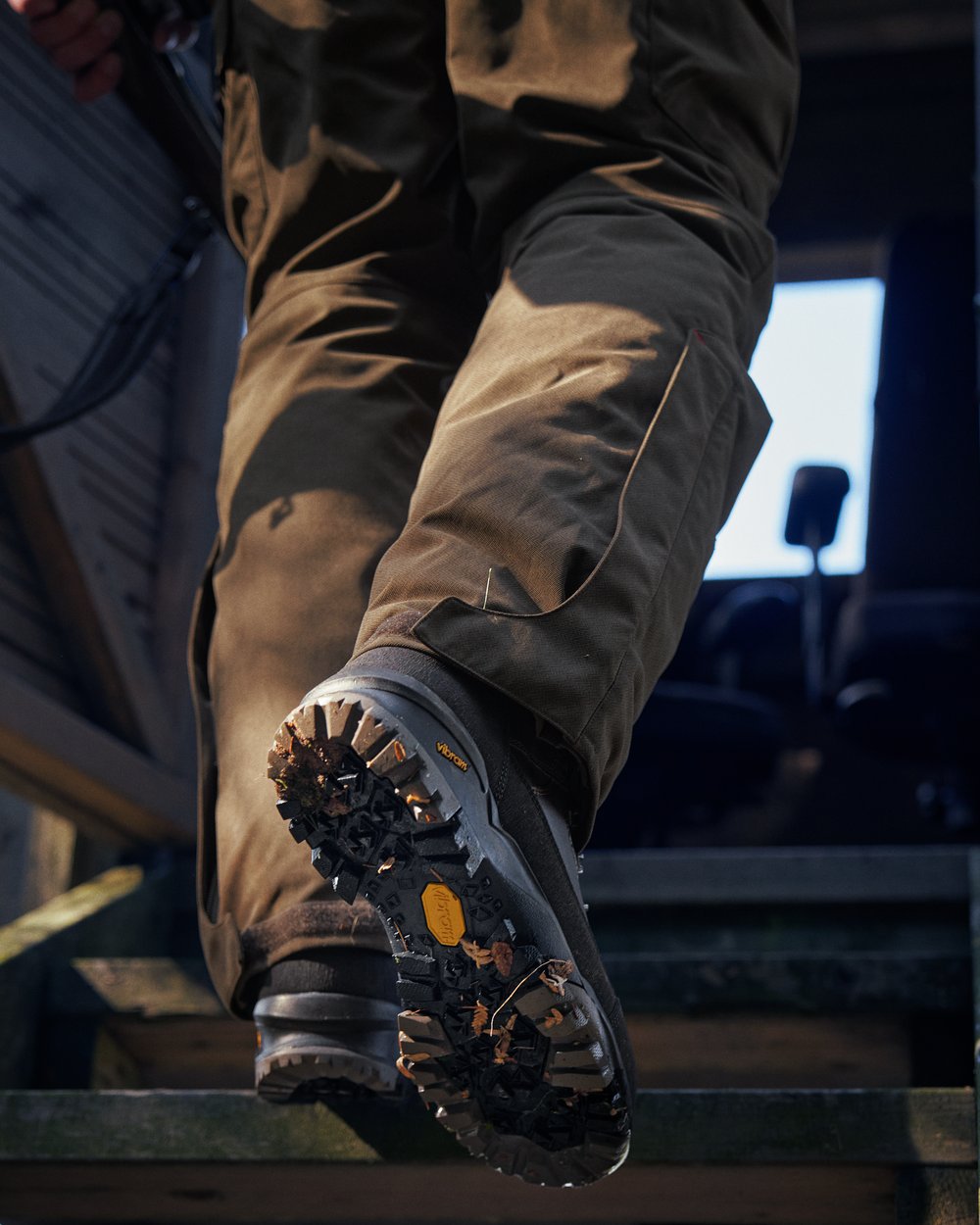 Dark Brown Coloured Harkila Driven Hunt 2.0 GTX Boots on outdoor background #colour_dark-brown