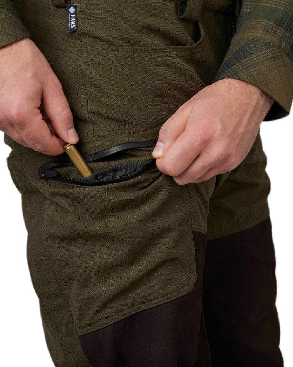 Willow Green Shadow Brown Coloured Harkila Driven Hunt HWS Leather Trousers on white background #colour_willow-green-shadow-brown