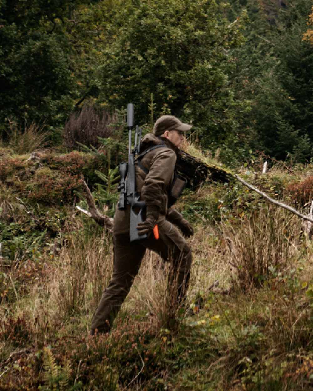 Hunting Green Shadow Brown Coloured Harkila Forest Hunter GTX Jacket on outdoor background #colour_hunting-green-shadow-brown