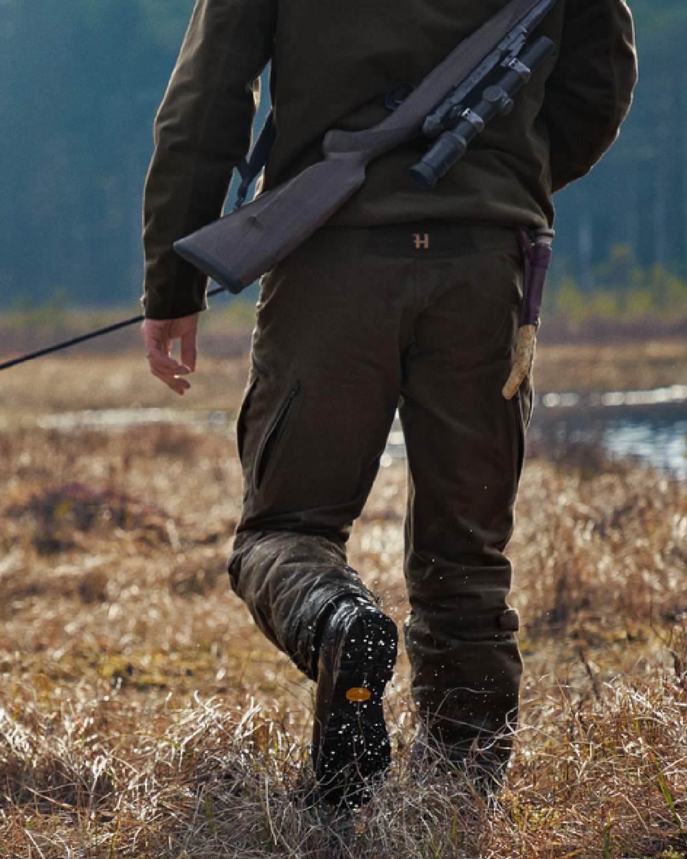 Willow Green Coloured Harkila Forest Hunter Hi GTX Boots on outdoor background #colour_willow-green