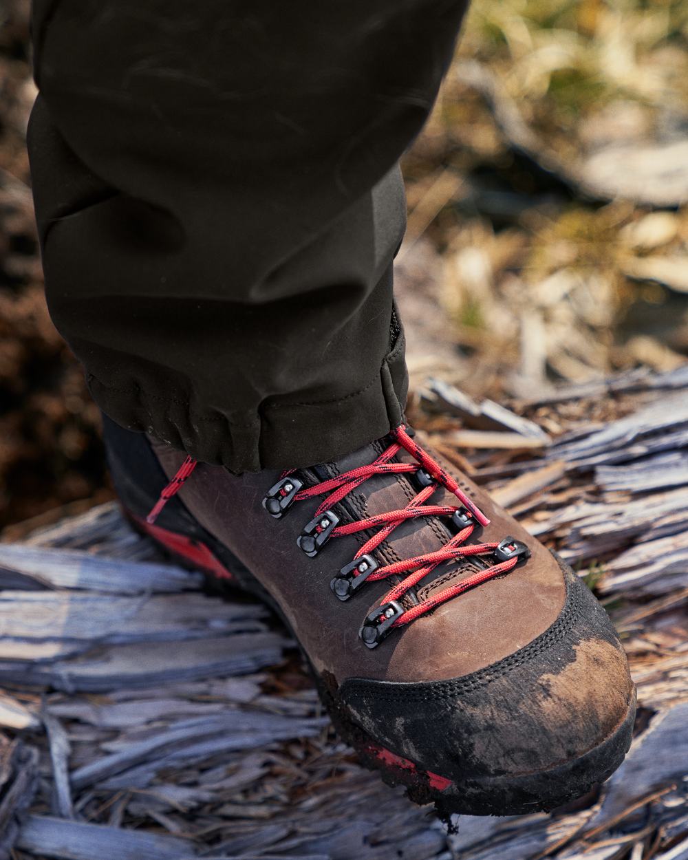 Dark Brown Coloured Harkila Forest Hunter Mid GTX Boots on outdoor background #colour_dark-brown