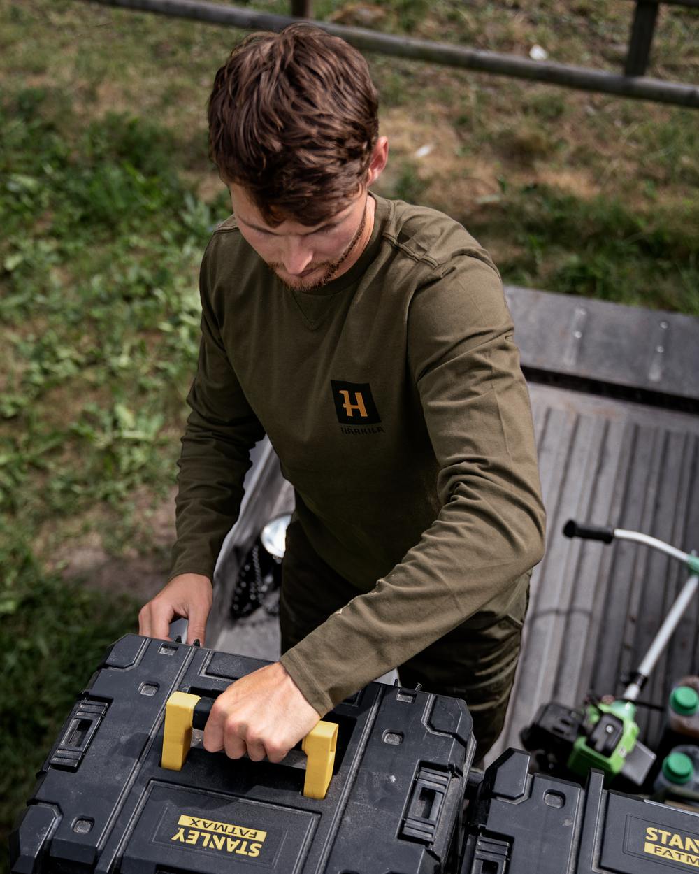 Willow Green Coloured Harkila Gorm Long Sleeve T-Shirt on outdoor background #colour_willow-green